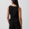 Bawełniany top z gazy z marszczoną talią i peplum