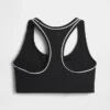 Biustonosz sportowy GapFit Smooth z plecami typu racerback, przeznaczony do ćwiczeń o średniej intensywności