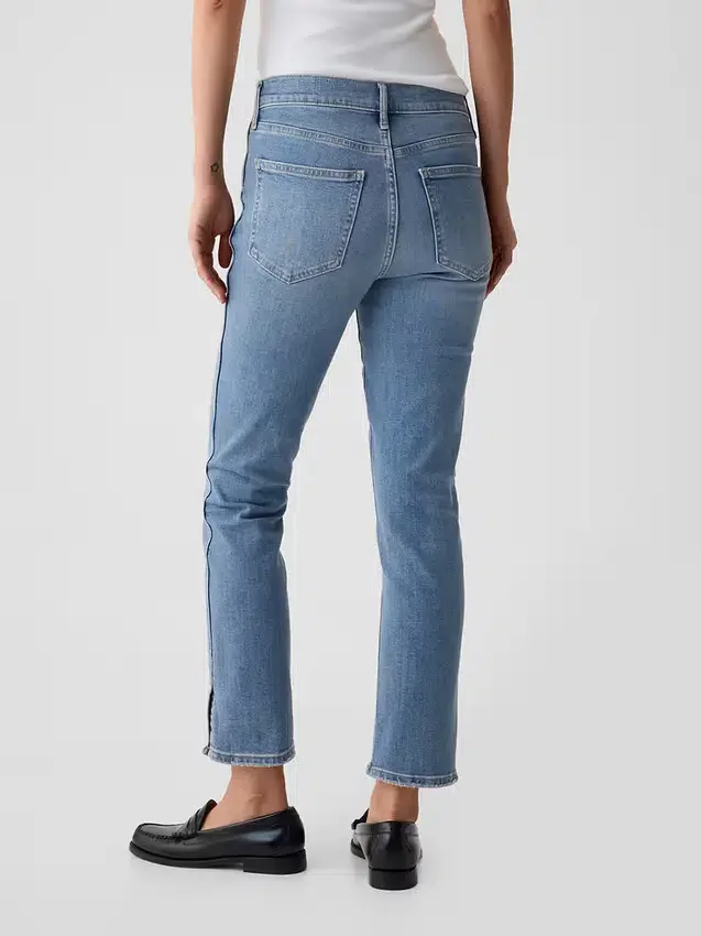 Dżinsy vintage slim o średnim stanie z rozcięciem na dole nogawek