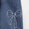 Dziecięce jeansy z niskim stanem i szerokimi nogawkami