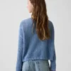 Dziecięcy sweter oversize z nadrukiem, wykonany techniką szydełkową
