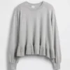 Dziecięcy sweter z luźnym peplum