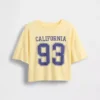 Dziecięcy T-shirt oversize o prostym kroju z logo stanu
