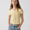 Dziecięcy T-shirt z dzianiny pointelle z prążkowanym wykończeniem i zapięciem na guziki z przodu