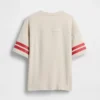 Dziecięcy T-shirt z grubej bawełny dżersejowej w oversize'owym kroju z logo na szwie
