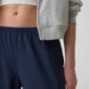 Spodnie GapFit Tech o niskim stanie i luźnym kroju
