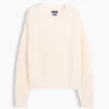 Swetr oversize z dekoltem w serek, wykonany w 100% z bawełny