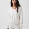 Swetr oversize z dekoltem w serek z dzianiny CashSoft