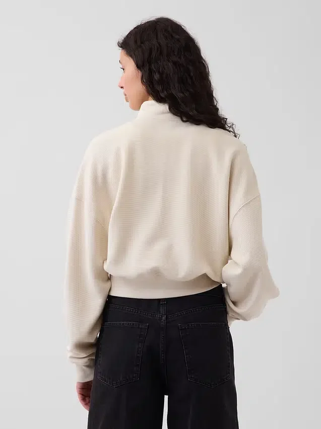 Teksturowana bawełniana bluza oversize z półzamkiem
